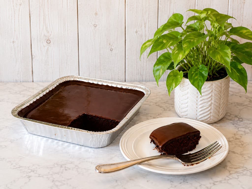 AhDelights chocolate cake tray with a plated slice